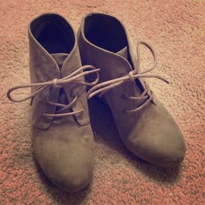 Wedged lace up booties